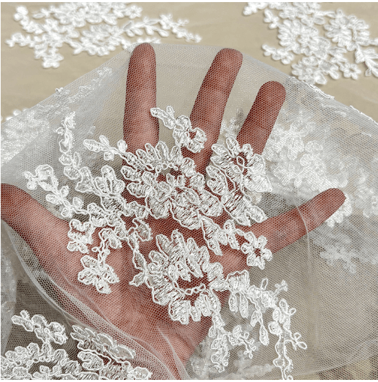 Sheer soft bridal tulle with fine floral embroidery detail
