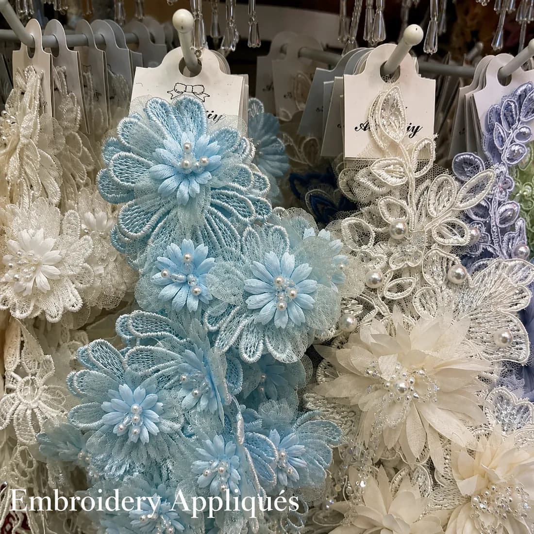 blue and ivory embroidery appliqués