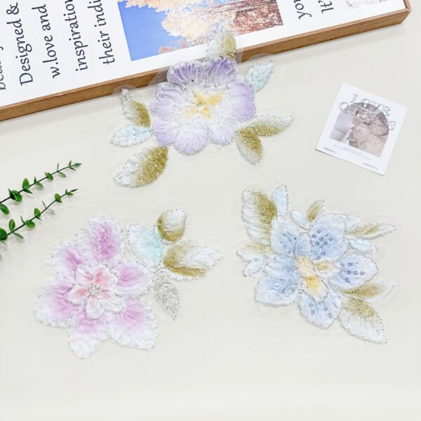 Layered 3D flower lace appliques used for a buyer comparison with flat embroidery